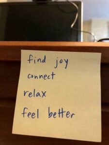 sticky note that says find joy connect relax feel better